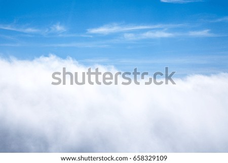 Blue sky and beautiful clouds seen from above on a sunny day