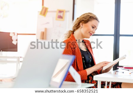 Young woman in office