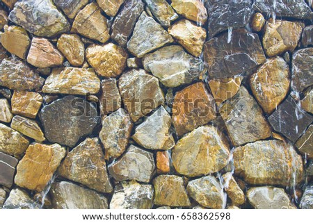 Fragment of wall from chipped stone. stone background.