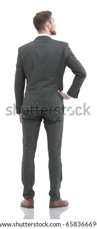 Business man in suit  from the back - looking at something over 