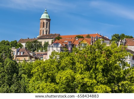 A view of the Mary Magdalene Tower from the edge the Castle District in Budapest in summertime Royalty-Free Stock Photo #658434883