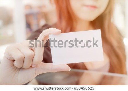 Business women showig a blank business card