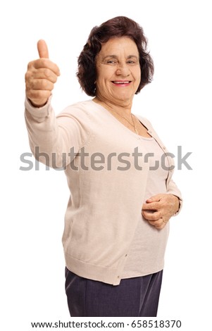 Senior lady making a thumb up gesture isolated on white background
