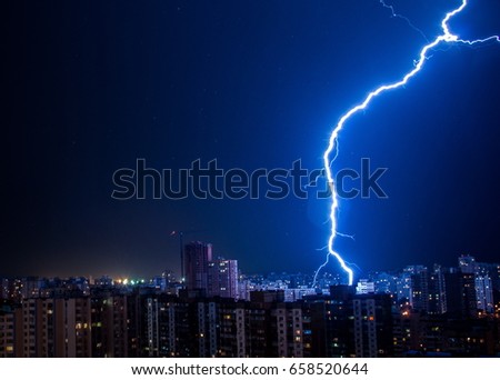 Lightning strike in the city Kyiv.. Storm outside. Thunderstorm with lightning in the city. Moment lightning