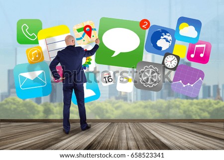 View of a Businessman in front of a wall drawing application multimedia internet - Internet concept