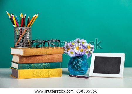 

A frame with books on the table.