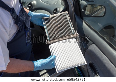 Clean and dirty cabin air filter for car Royalty-Free Stock Photo #658542931