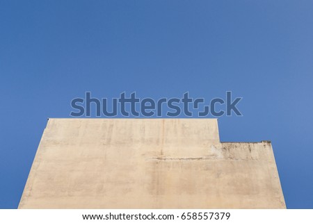 Blank wall on building with blue sky