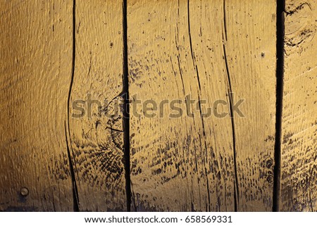 Yellow weathered boards of wood