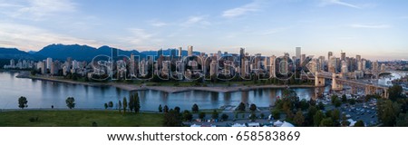 Aerial Panoramic Downtown City Skyline of Vancouver, British Columbia, Canada. Taken during bright sunny sunset.