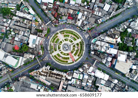 Aerial view road , beautiful street , roundabout,Top view, Background , Thailand .Expressway with car lots in the city, downtown, cityscape
