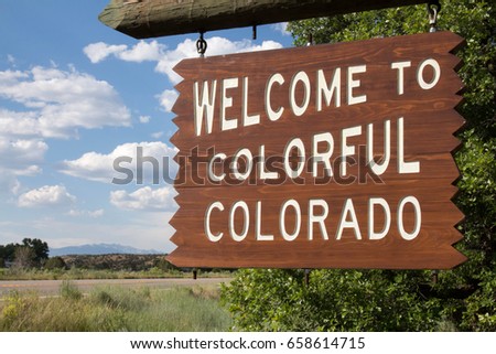Welcome to Colorful Colorado sign next to a road