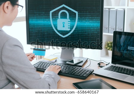select focus photo of female office worker holding personal credit card using computer system setup information security locking with back view.