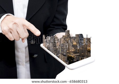 business man hold smart phone and buildings