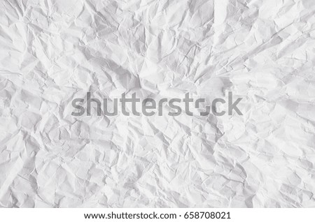 Crumpled white paper texture.