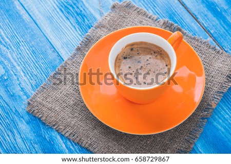 morning coffee cup on wood blue old table. tasty breakfast