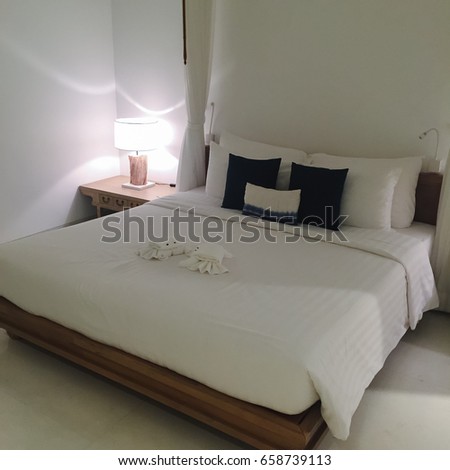 Clean hotel room with wooden bunk beds. Vintage effect style pictures.