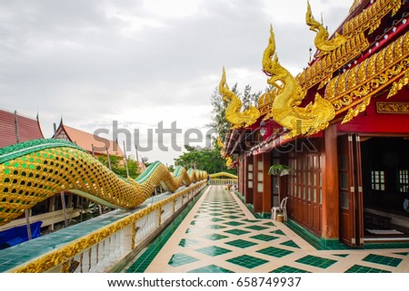 Roof of the temple thai art ,serpent on the top