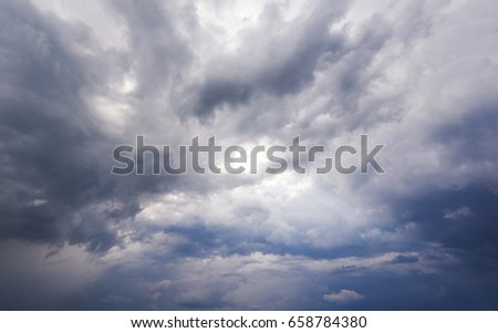 Cloudy stormy black and white dramatic sky background.