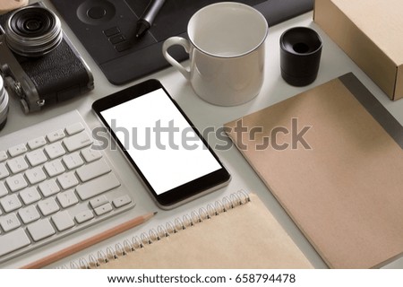 Designer desk mockup. Desk, Camera - Photographic Equipment, Smart Phone, mug on white top table.