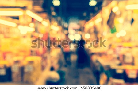 Abstract blur image of Day market with bokeh  for background usage. (vintage tone)