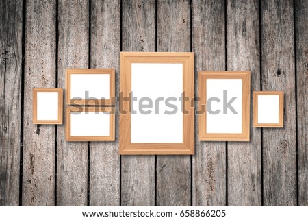 Collage of blank brown wooden frames , interior decor mock up on old wooden wall, vintage style.