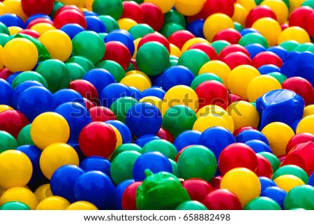 Many colorful plastic balls in the pool for children
