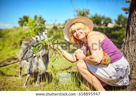 Funny picture a beautiful young girl farmer with in Hat