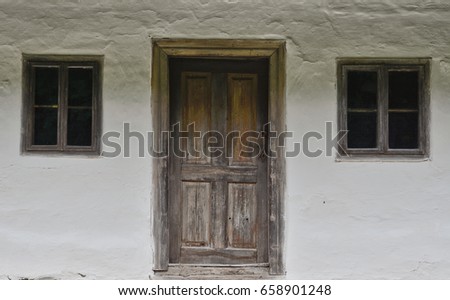 Vintage door and window. Wooden front door of an old house. Abstract