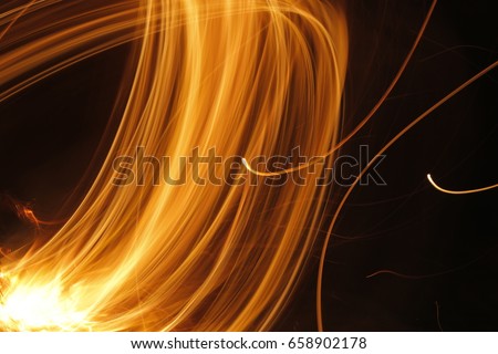 Abstract fire line, glowing yellow light for effect and background