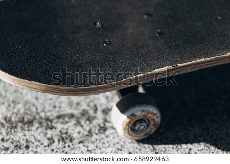 Skateboard on skate park at sunset.