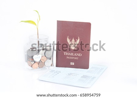 Business and finance concept to saving money for travel on vacation time.Gold and silver coins in glass bottle and Thailand passport isolated on white background.