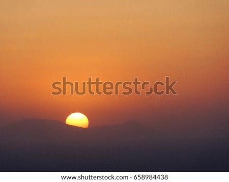 Beautiful sunset seem from Santorini Oia Village on the caldera cliffs, Santorini, Cyclades, Aegean Sea, Greek island, Greece