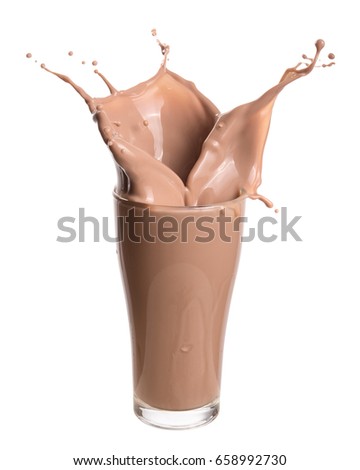 Chocolate milk splash out of glass., Isolated on white background. Royalty-Free Stock Photo #658992730