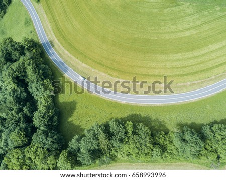 Aerial view of road with car
