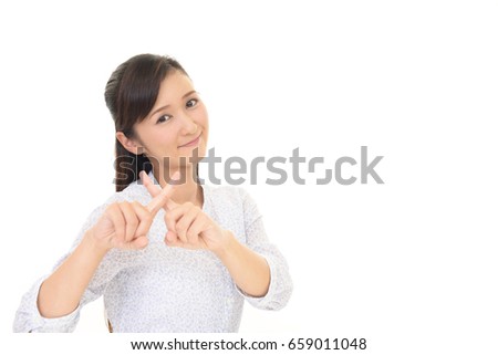 Woman demonstrating prohibiting gesture