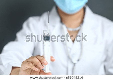 female doctor using syringe