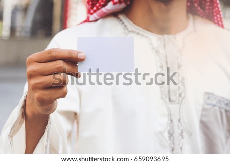 Arab Businessman hand showing business card