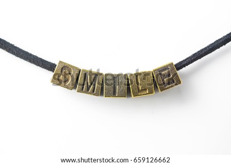 Creative design concept - top view of metal cube word " smile " link with line, isolated on white background