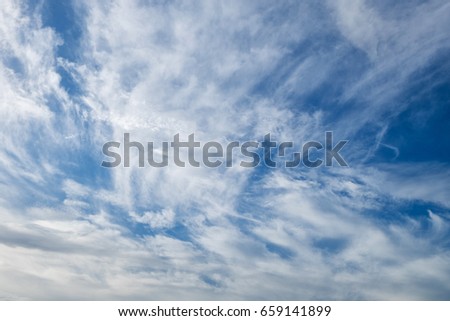 Many clouds in the blue sky background.