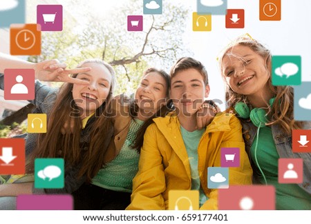 friendship, technology and people concept - happy teenage friends or high school students having fun and making faces with menu icon