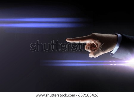 business, people and choice concept - close up of businessman hand pointing finger over black background