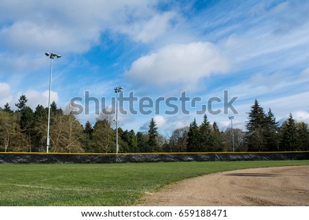 Woodland Park Baseball Field Outfield: The outfield of a baseball diamond in Woodland Park Seattle. Royalty-Free Stock Photo #659188471