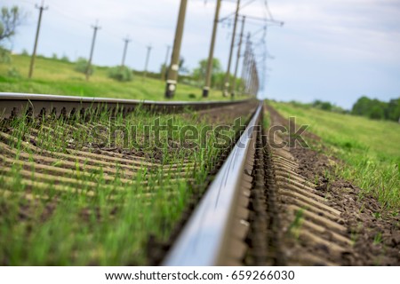The railway rail goes into the distance