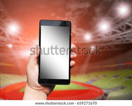 Black mobile phone with touch screen in hand