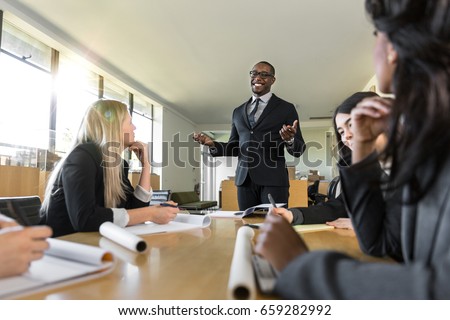 Business people attentive listening to marketing professional executive speaker presentation Royalty-Free Stock Photo #659282992