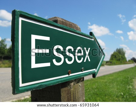 ESSEX arrow signpost along a rural road