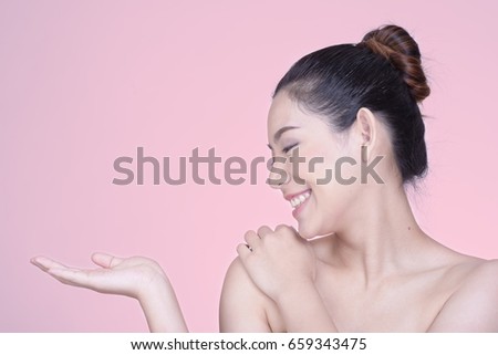 Portrait of beautiful young brunette woman with clean face. Beauty spa model girl with perfect fresh clean skin. Youth and skin care concept.