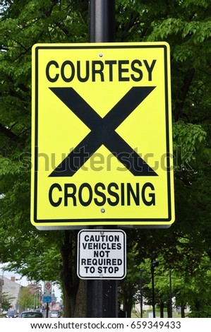 Courtesy crossing sign