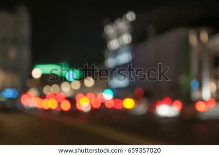 Image of blur street and cars with colorful lights in night time for background usage. Light blur bokeh, defocused backdrop